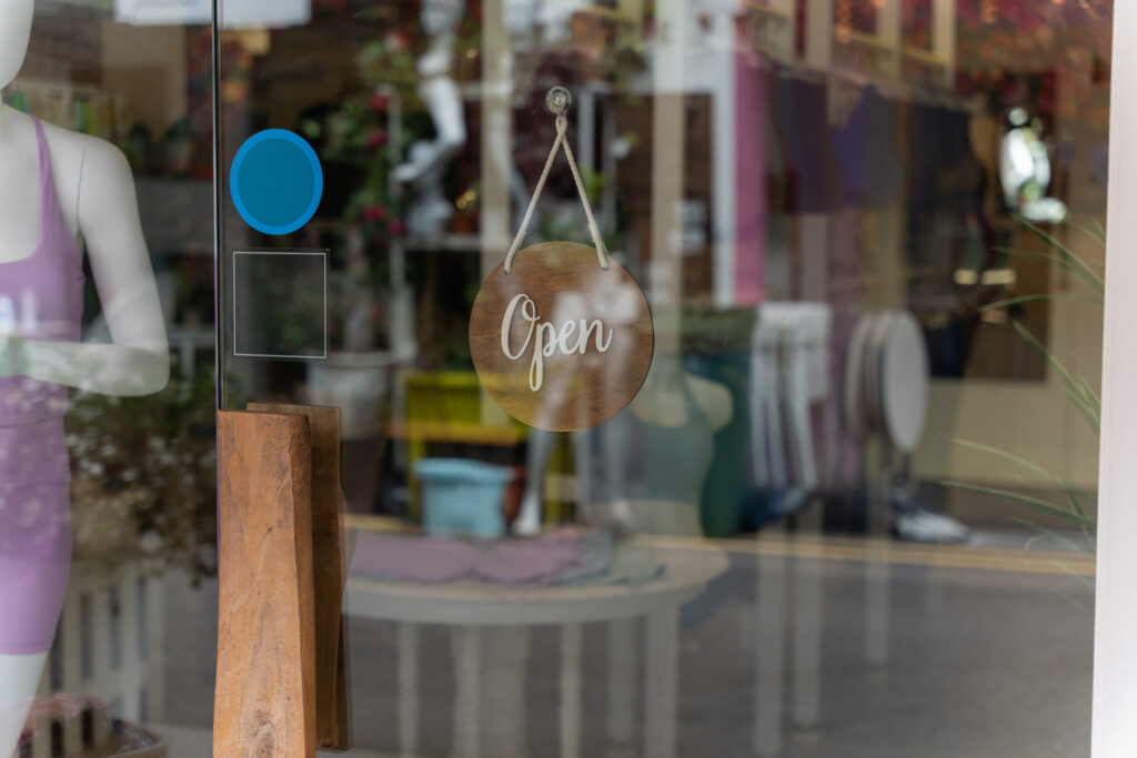 Shop front with a sign saying 'open'.