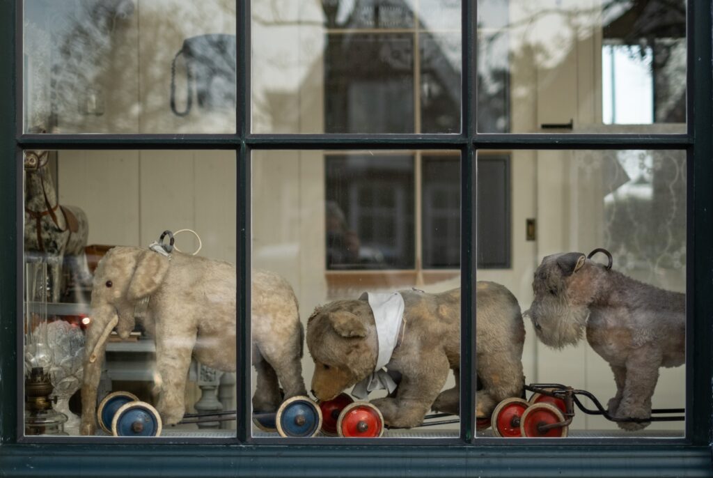 Shop front with old toys that has newly repaired glass