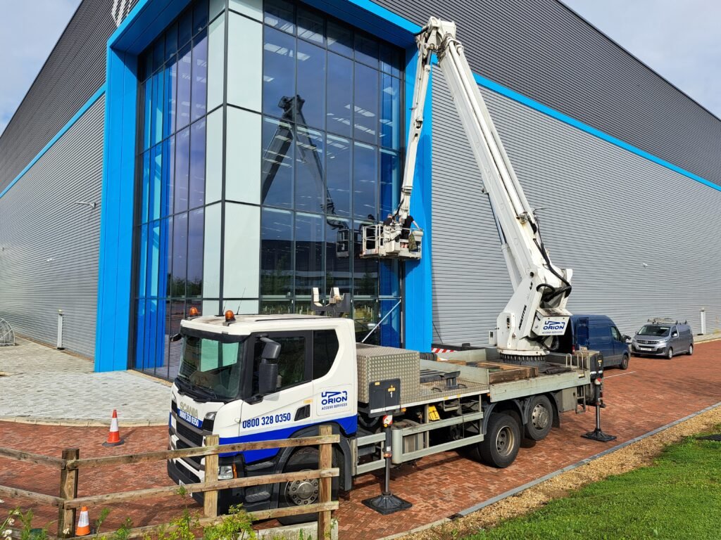 Truck-mounted access platform used for glazing replacement at the JD.com warehouse
