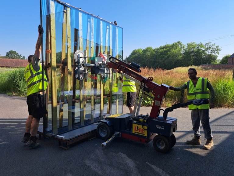 Large double-glazed replacement unit being handled with specialist lifting equipment at Black Country Living Museum