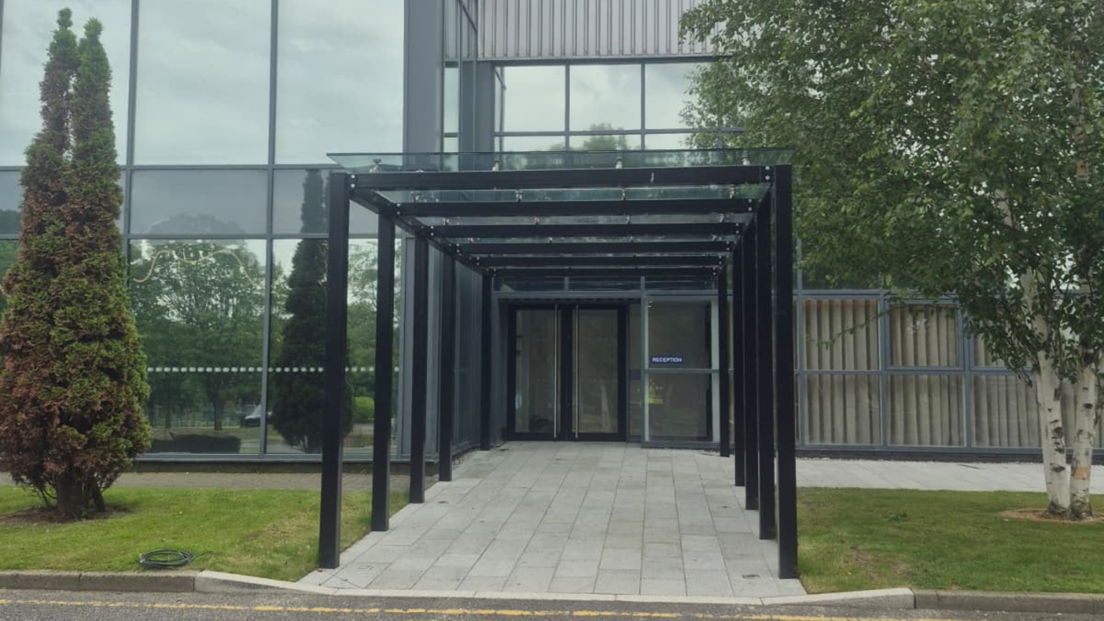 Completed glazed entrance canopy at Senator Furniture HQ in Accrington